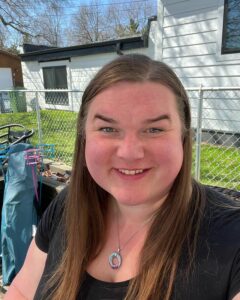 Rebecca sits in the sun in her backyard in Minnesota